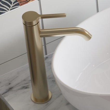 product lifestyle image of Britton Hoxton 2.0 Brushed Brass Tall Basin Mixer Tap next to basin HOX112DNF